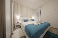 Posteľ alebo postele v izbe v ubytovaní Luxury Majpruz Suites