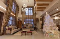 a living room with a christmas tree in it at Happiness Pass On in Wujie