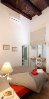 A bed or beds in a room at Napoli Pietrasanta LT