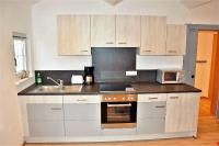 Kuchyňa alebo kuchynka v ubytovaní Tennladen Apartments