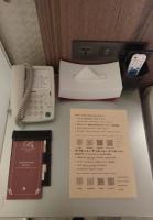 a desk with a fax machine and a phone at Beauty Hotels Taipei - Hotel B7 in Taipei