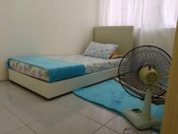 A1-04-03 Damiana Apartmentにあるベッド