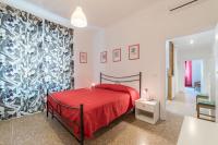 Posteľ alebo postele v izbe v ubytovaní Red & White Vatican Apartment