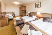 Postel nebo postele na pokoji v ubytování Hotel Polanica Resort & Spa