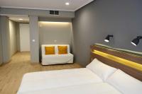 Posteľ alebo postele v izbe v ubytovaní Hotel Alda Sada Marina