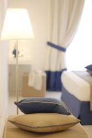 A bed or beds in a room at Il Borghetto Resort & Spa