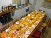 a kitchen with a table with plates and dishes on it at Chambres d&#39;Hôtes Mazurier in Cozes