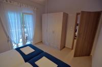 Postel nebo postele na pokoji v ubytování Camping Orpheus Apartments