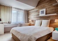 Postel nebo postele na pokoji v ubytování Cihelny Golf & Wellness Resort