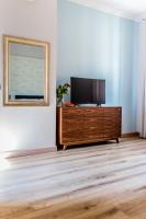 Televízia a/alebo spoločenská miestnosť v ubytovaní Apartamenty Glamour
