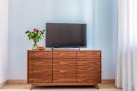 Televízia a/alebo spoločenská miestnosť v ubytovaní Apartamenty Glamour