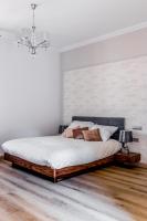 Posteľ alebo postele v izbe v ubytovaní Apartamenty Glamour