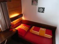 A bed or beds in a room at Almblick Appartements