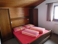 A bed or beds in a room at Almblick Appartements