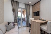 Televízia a/alebo spoločenská miestnosť v ubytovaní Luxury Apartments Garden