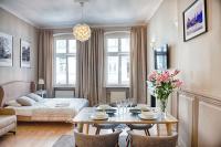 Posteľ alebo postele v izbe v ubytovaní Apartament Kopernika 25