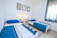 Posteľ alebo postele v izbe v ubytovaní Family Beach Apartments