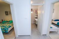 Posteľ alebo postele v izbe v ubytovaní Family Beach Apartments
