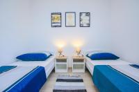 Posteľ alebo postele v izbe v ubytovaní Family Beach Apartments