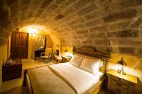 Postel nebo postele na pokoji v ubytování Maya Cave