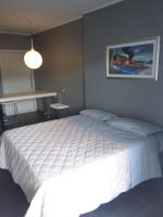 A bed or beds in a room at Uniclub House