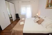 Posteľ alebo postele v izbe v ubytovaní Apartman Viktoria
