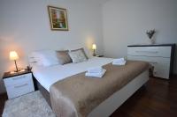Posteľ alebo postele v izbe v ubytovaní Apartman Viktoria