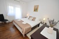 Posteľ alebo postele v izbe v ubytovaní Apartman Viktoria