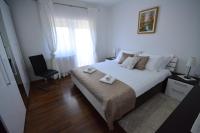 Posteľ alebo postele v izbe v ubytovaní Apartman Viktoria