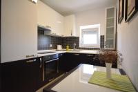 Kuchyňa alebo kuchynka v ubytovaní Apartman Viktoria