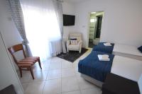 Posteľ alebo postele v izbe v ubytovaní Apartman Viktoria