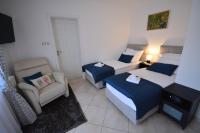 Posteľ alebo postele v izbe v ubytovaní Apartman Viktoria