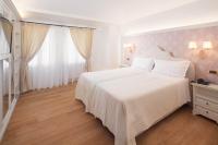 Łóżko lub łóżka w pokoju w obiekcie Hotel Villa Condulmer