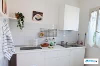 A kitchen or kitchenette at Terrazza del Santo 2,0 - La Terrazza nel cuore di Napoli