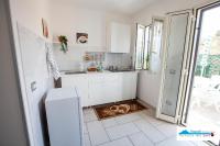 A kitchen or kitchenette at Terrazza del Santo 2,0 - La Terrazza nel cuore di Napoli