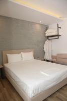 Postel nebo postele na pokoji v ubytování Coral Boutique Apartments