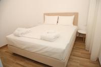 Postel nebo postele na pokoji v ubytování Coral Boutique Apartments