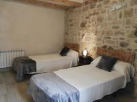 Postel nebo postele na pokoji v ubytování Casa Rural Santana