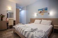 Postel nebo postele na pokoji v ubytování Myrtis Spa Hotel