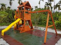 a small playground with a slide and a house at 蔓條絲裡Slow Motion B&amp;B in Yuchi