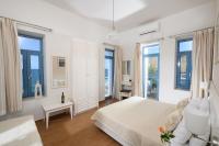 Posteľ alebo postele v izbe v ubytovaní Captain's House Hotel Suites & Apartments