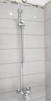 a shower in a bathroom with a shower head at Val&#39; Appart 1 in Valenciennes