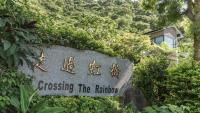 a sign forassing the railway on top of a mountain at Crossing The Rainbow Bridge B&amp;B in Chongde