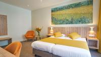 Hotel Asterisk, a family run hotelにあるベッド