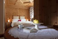 Posteľ alebo postele v izbe v ubytovaní Hotel Baita Fiorita