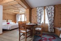 Posteľ alebo postele v izbe v ubytovaní Hotel Baita Fiorita