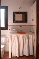 a bathroom with a sink and a mirror at Paraiso Perdido in Conil de la Frontera