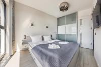 Posteľ alebo postele v izbe v ubytovaní Apartamenty Sun & Snow Horyzont