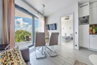 Televízia a/alebo spoločenská miestnosť v ubytovaní Apartamenty Sun & Snow Horyzont