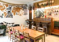 a dining room with a wooden table and chairs at Green Park Homestay in Luodong
